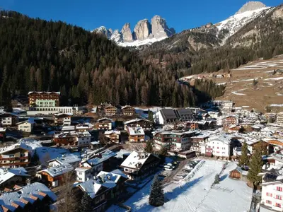 an aerial view of a small village in the mountains at Aliza in Campitello di Fassa