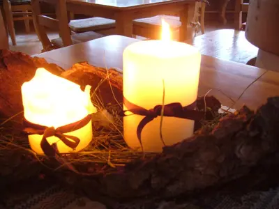 two candles sitting on top of a table at Rifugio Monti Pallidi in Canazei