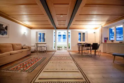 a living room with a couch and a table at Apartments Stina in Ortisei