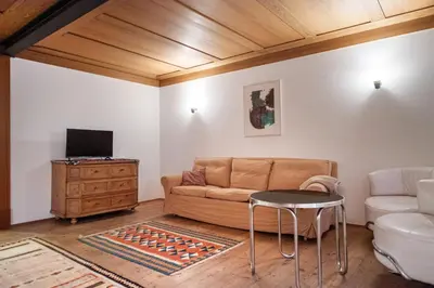 a living room with a couch and a table at Apartments Stina in Ortisei