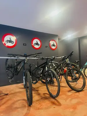 a group of bikes parked against a wall at Hotel B&B Andreas in Canazei