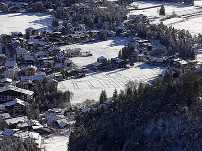 an aerial view of a village in the snow at Residence Soratru in San Vigilio Di Marebbe