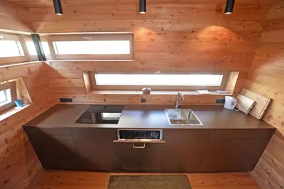 an overhead view of a kitchen in a tiny house at Design Lodge The Cube in Ortisei