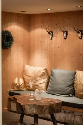 a room with a couch and a coffee table at Hotel Dolomiti in La Villa