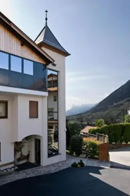 a building with a view of a mountain at Pension Monika in Lagundo
