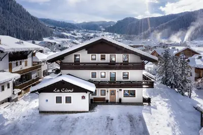 a ski lodge in the snow in a town at La Cianò in Corvara in Badia