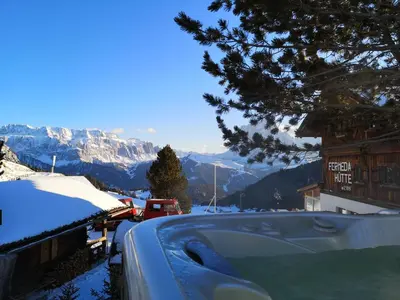 a bedroom with two beds and a window at Rifugio Fermeda Hutte in Santa Cristina in Val Gardena