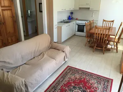 a kitchen and dining room with a table and chairs at Gal28 in Predazzo