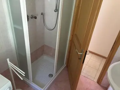 a bathroom with a sink and a toilet at Gal28 in Predazzo
