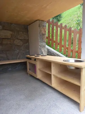 a room with a sink and a counter with a window at Ferienhaus/Chalet in der Blaiche in San Leonardo in Passiria