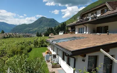a house with a view of a mountain at Weingut Zundlhof in Bolzano
