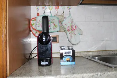 a blow dryer sitting on a counter next to a sink at Appartamento Widmann in Coredo