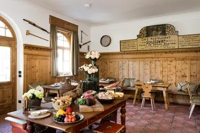 a room with a table with food on it at Schlosswirt Forst in Lagundo