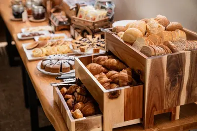 a table filled with lots of different types of pastries at Residence Lastei in San Martino di Castrozza