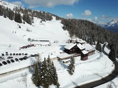 an aerial view of a ski lodge in the snow at Casa Cucciolo Falcade in Falcade