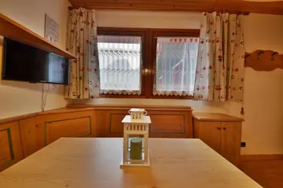 a small glass jar sitting on top of a table at Casa Cucciolo Falcade in Falcade