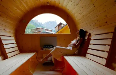 a round house in the snow in a forest at Hotel Cima Rosetta - BW Signature Collection in San Martino di Castrozza