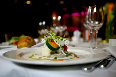 a plate with a dessert on a table at Hotel Alle Alpi in Moena
