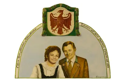 a picture of a man and a woman on a plate at Hotel Dolomiti Schloss in Canazei