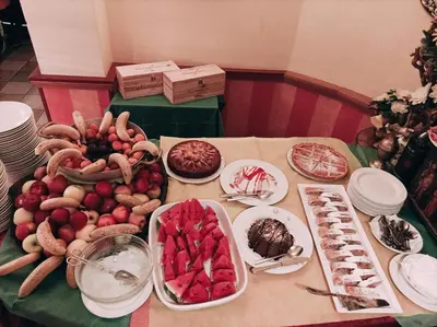 a table topped with lots of different types of food at IHR Hotel Villa Emma in Canazei