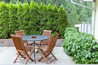 a table and four chairs sitting around a patio at Haus Angelika in Nova Levante