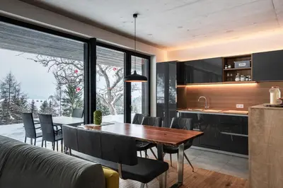 a kitchen and dining room with a table and chairs at naturApart in Brunico