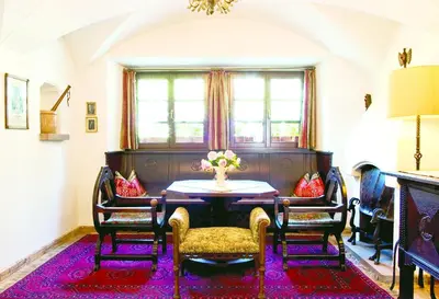 a dining room with a table and chairs at Mirabell Alpine Garden Resort & Spa in Siusi