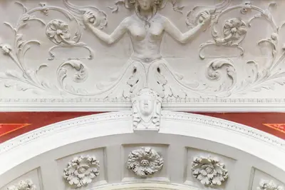 a statue above the door of a building at Grand Hotel Bellevue - adults only in Merano