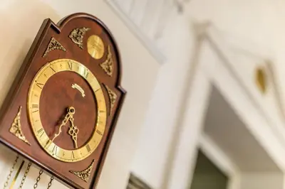 a clock hanging on the side of a wall at Grand Hotel Bellevue - adults only in Merano
