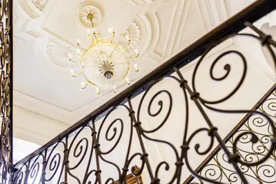 a chandelier hanging from a ceiling at Grand Hotel Bellevue - adults only in Merano