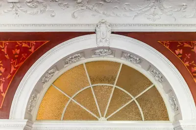 an archway in a building with a white ceiling at Grand Hotel Bellevue - adults only in Merano