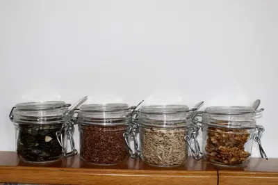 a row of jars of seeds and nuts on a shelf at Gruberhof in Postal
