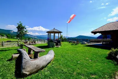a statue of a bird sitting on a park bench at Agriturismo Reinhof in San Felice