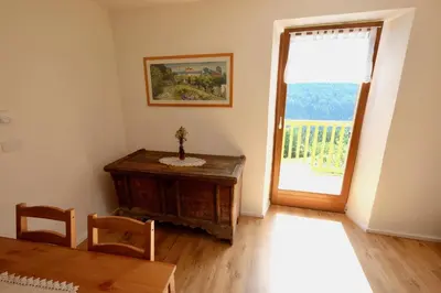 a dining room with a table and a window at Agriturismo Reinhof in San Felice