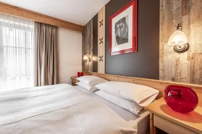 a bedroom with a white bed and a window at B&B Tamarindo in La Villa