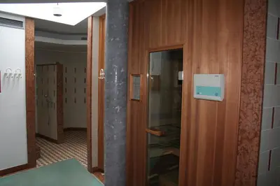 a hallway with a door to a room at Hotel Krone in Brunico