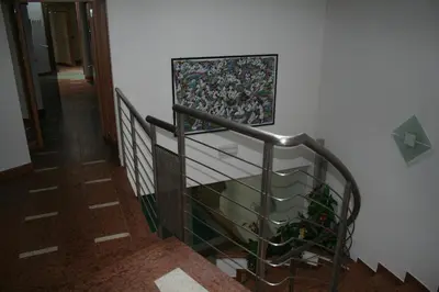 a stairway with a painting on the wall at Hotel Krone in Brunico