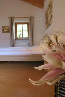 a bedroom with a bed and a window at Winklerhof in Parcines