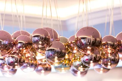 a chandelier with lots of silver and gold balls at Hotel Garden in Moena