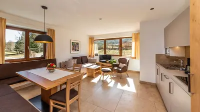 a room with a kitchen and a living room at Residence Tolderhof - Olang in Valdaora