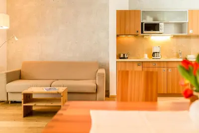 a living room with a couch and a table at Residence Tolderhof - Olang in Valdaora