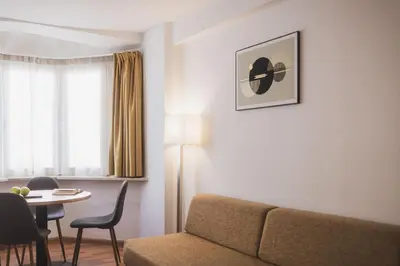 a living room with a couch and a table at Residence Chiavi D'Oro - Goldener Schlüssel in Bressanone