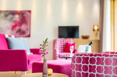 a living room with a view of a balcony at Der Verdinser Hof in Schenna