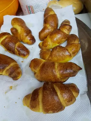 a group of croissants sitting on a table at Albergo Posta in Colle Santa Lucia