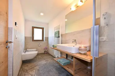 a bathroom with a sink and a mirror at Planatschhof in Villnoss