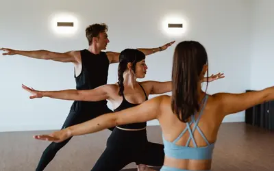 a group of people performing aorative yoga class at Paradiso Pure Living Vegan Hotel in Alpe di Siusi