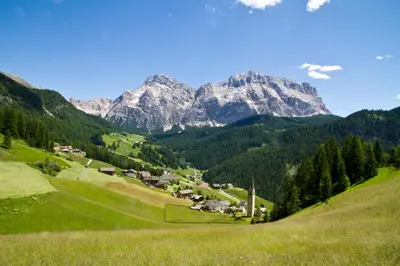 a small village in a valley with mountains in the background at Apartments Ruac in La Valle