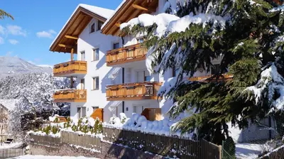 a snow covered building with balconies on it at B&B L'Arca di Noè in Laion