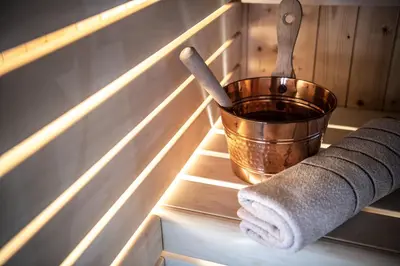 a towel and a bucket sitting on a shelf at Chalet Cogolara in Colfosco