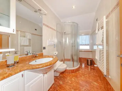 a bathroom with a sink and a shower and a toilet at Apartment Plan de Socrep in Santa Cristina in Val Gardena